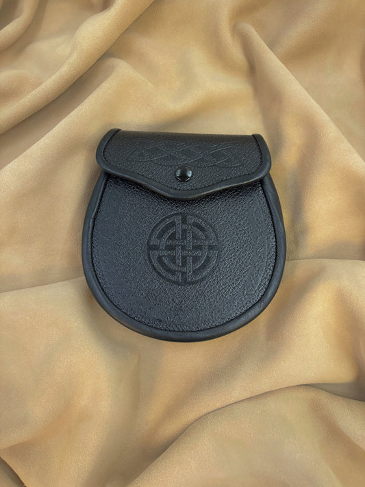 This sporran has a grained black leather front and back. It features an embossed Celtic weave pattern on the flap and an embossed Celtic Eternity Circle on the front.
