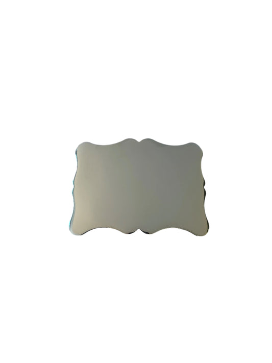 Silver buckle with scalloped edges