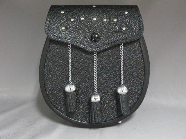  sporran features an embossed flap with chrome studwork, black grained leather front, black grained leather back and 3 black leather tassles on chrome chain/balls.