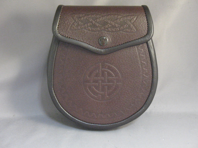 Sporran with a grained brown leather front and back, with an embossed Celtic weave pattern on the flap and an embossed Celtic Eternity Circle on the front.