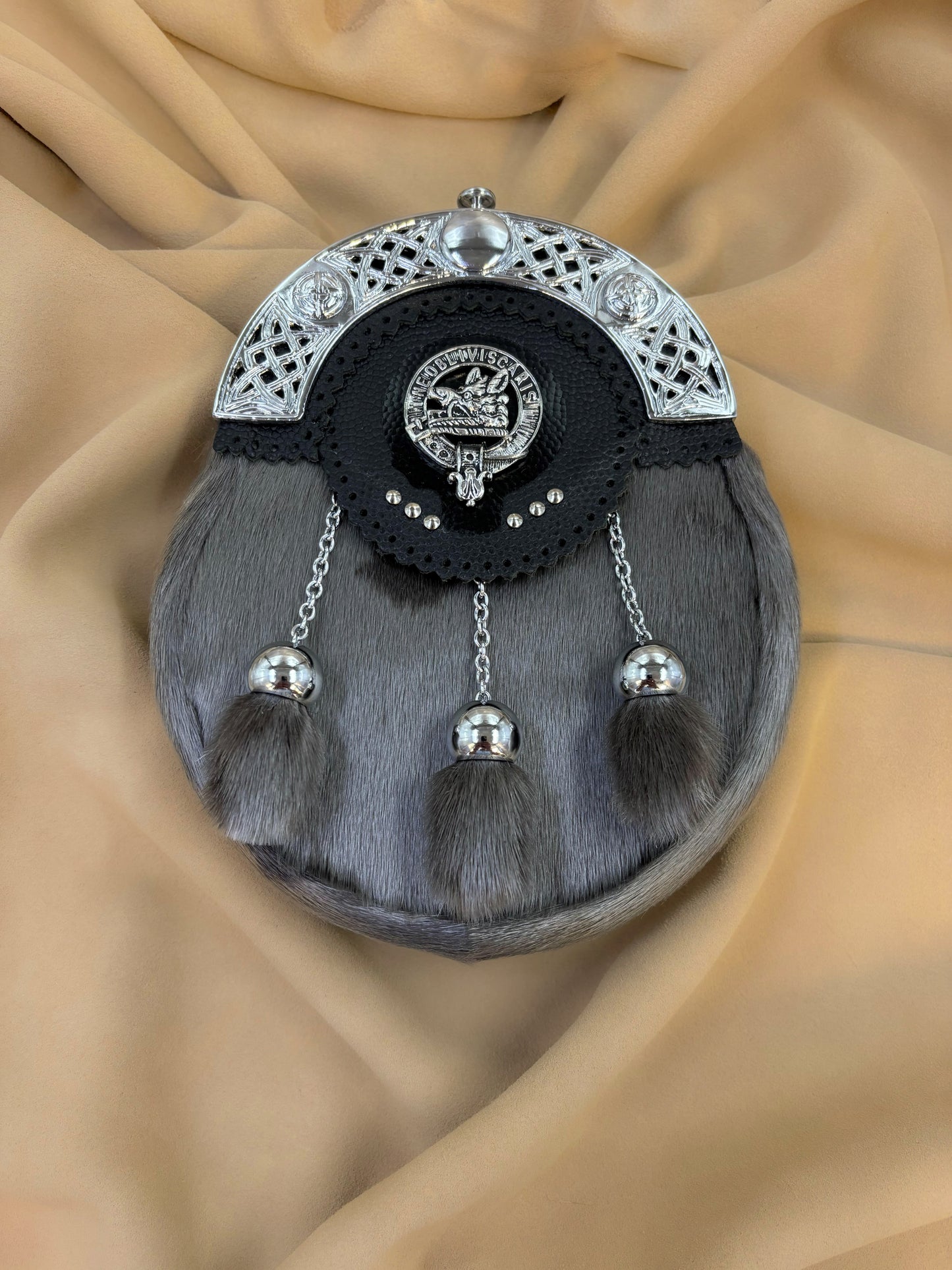 Grey seal sporran with pewter clan crest and three tassels