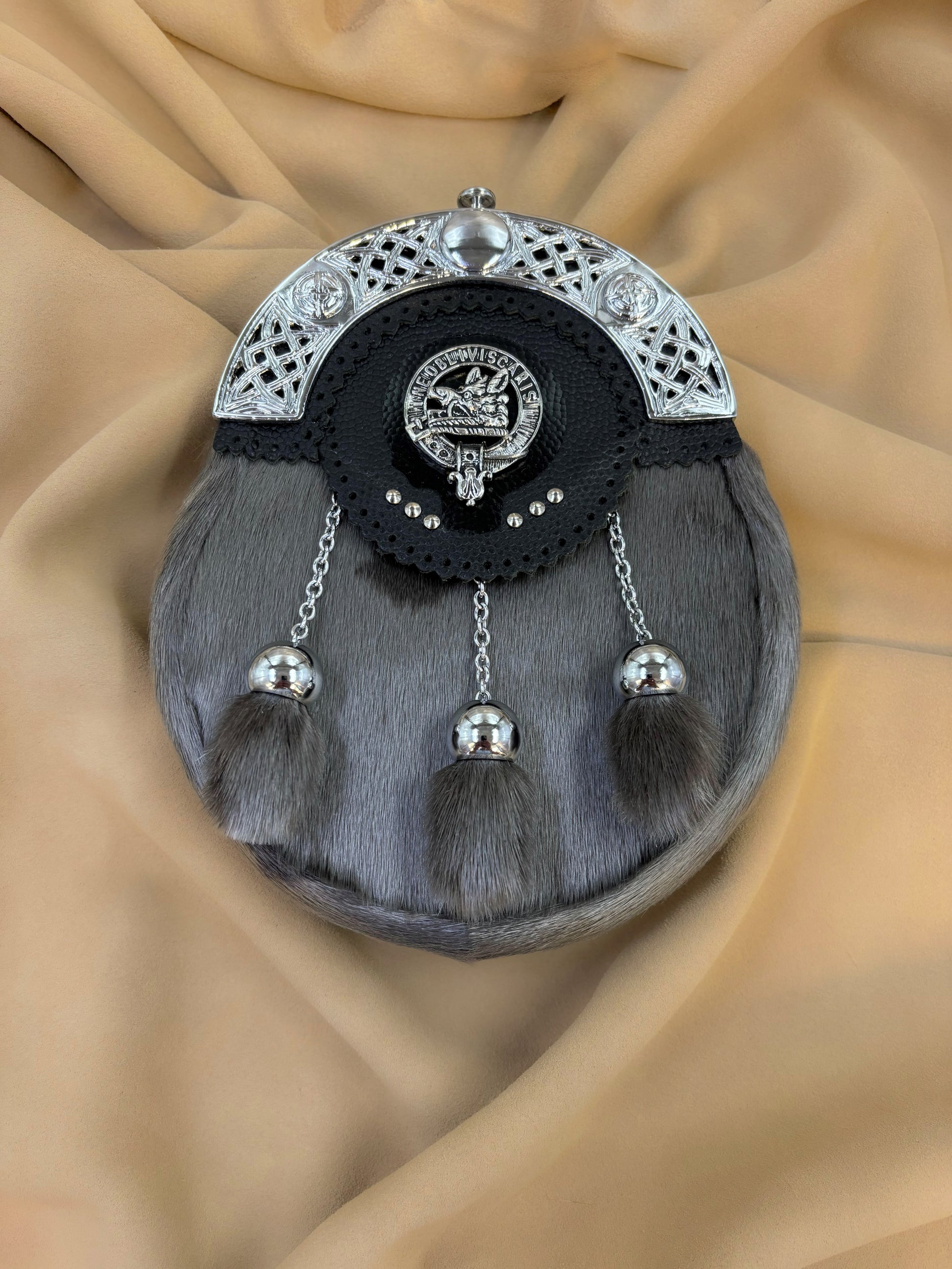 Grey seal sporran with pewter clan crest and three tassels